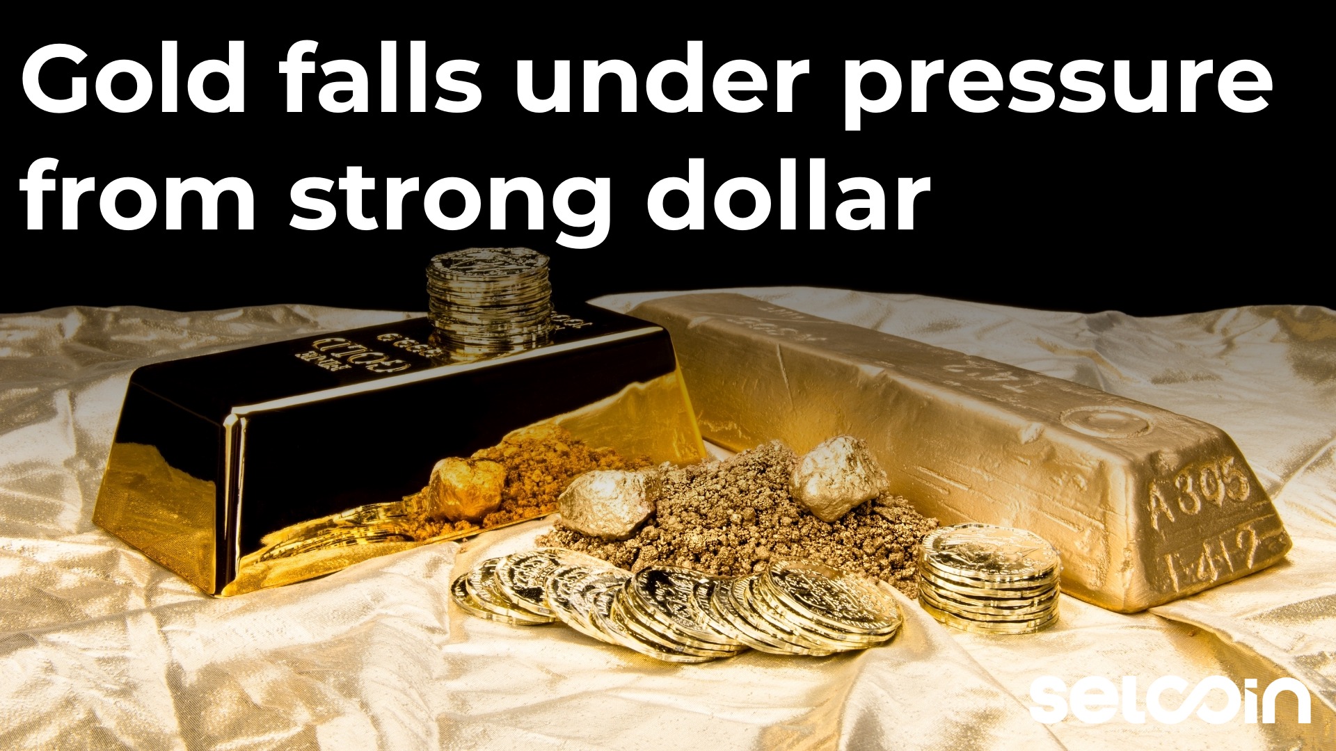 Gold falls under pressure from strong dollar