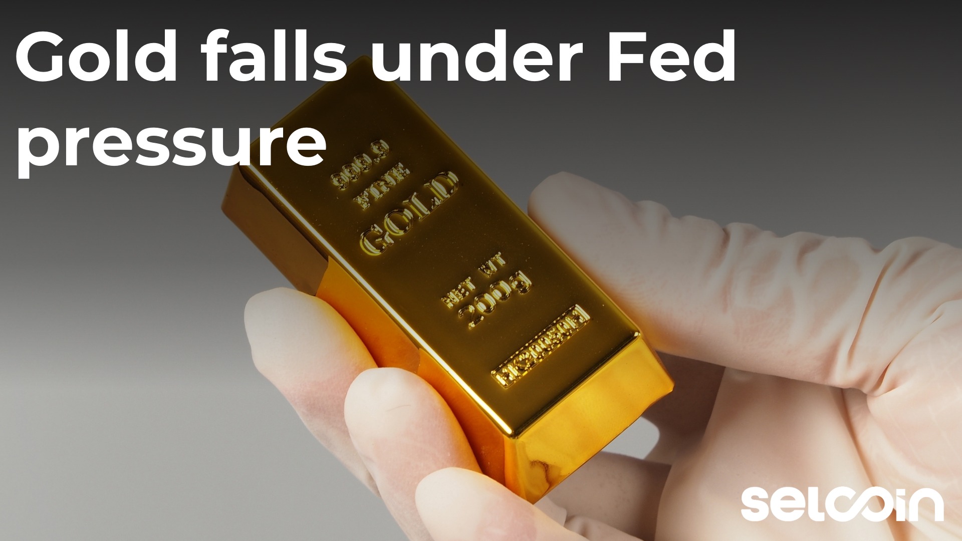 Gold falls under Fed pressure